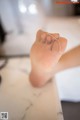 A close up of a person's foot with a bandage on it.